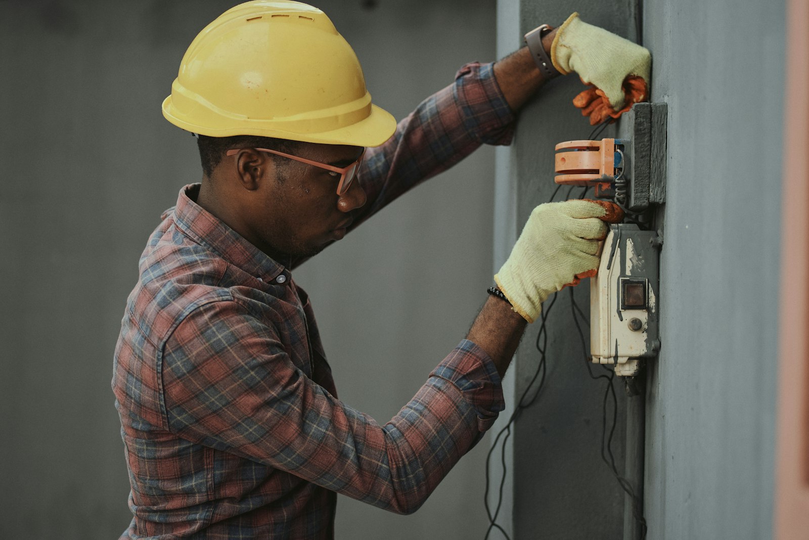 Hands at an electrical panel